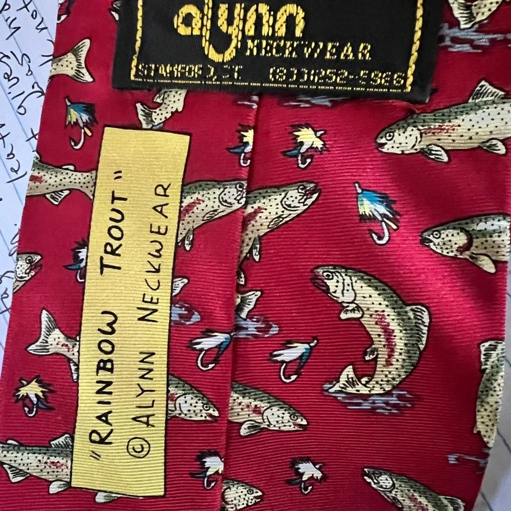 Rainbow trout neck tie by Alynn Neckwear. It is red with rainbow trout.